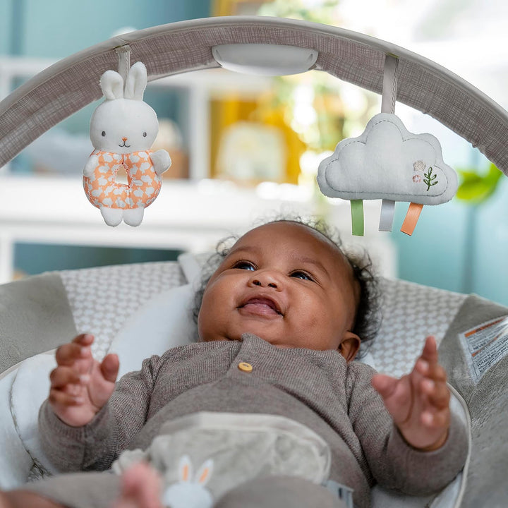 Inlighten Baby Bouncer Infant Seat with Light up -Toy Bar, Vibrations, Tummy Time Pillow & Sounds, 0-6 Months up to 20 Lbs (Twinkle Tails Bunny)