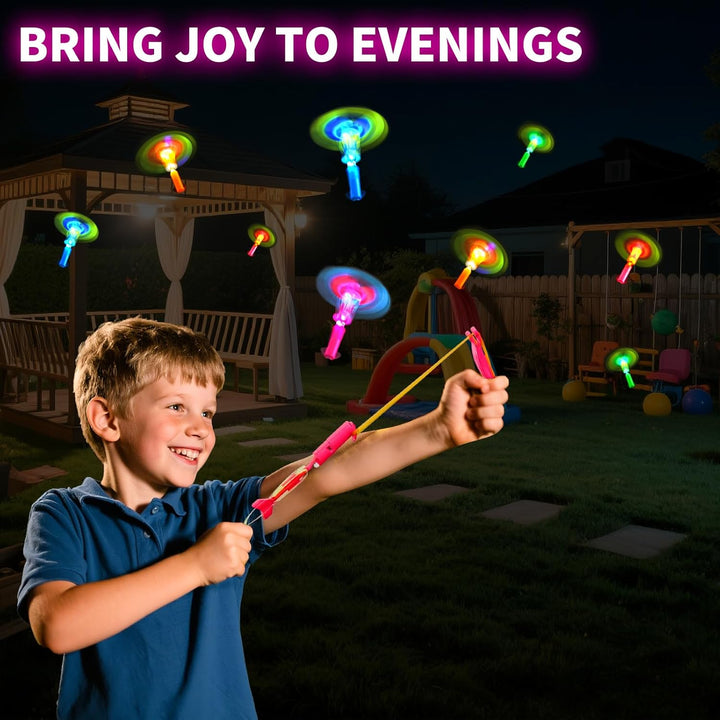 25 Packs LED Flying Toys Set with Whistle,25 Rocket Slingshot+25 Glow Arrow Helicopter for Summer Outdoor Camping Toys Game LED Slingshot Toy for Kids Glow in the Dark Party Supplies 8-12,4-8